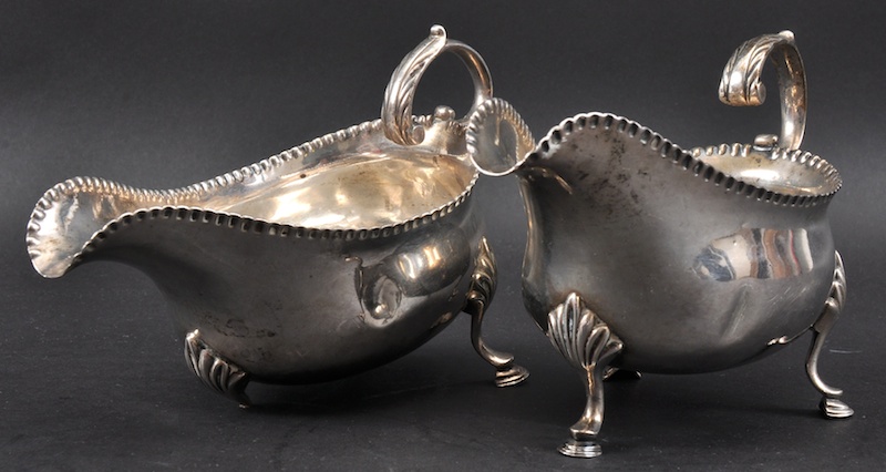 A PAIR OF GEORGE III SAUCEBOATS, acanthus handles and shell feet. London 1780. Maker’s Mark: W. S.