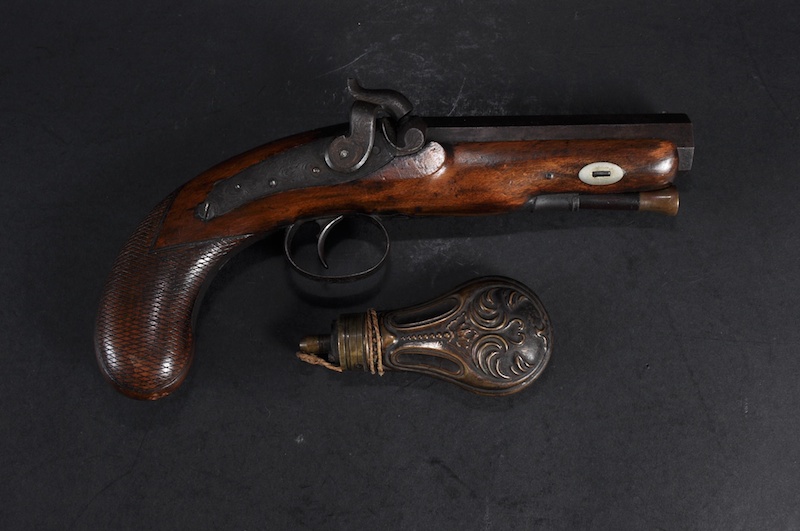 A PERCUSSION CAP PISTOL with mahogany stock and octagonal barrel, stamped London and a COPPER POWDER