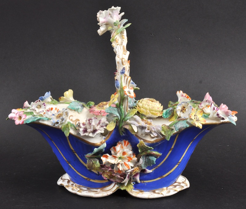 A 19TH CENTURY COALPORT BASKET encrusted with flowers. 8.5ins wide.