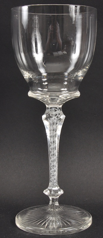 A LARGE PLAIN WINE GLASS with fluted white opaque twist stem and star base. 11.5ins high.