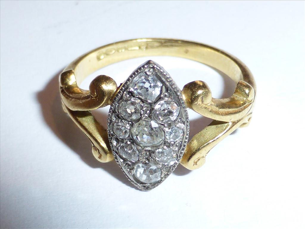 PRETTY 18CT GOLD RING WITH OLD CUT DIAMONDS IN AN OVAL SHAPED PAVE SETTINGPostage Cost (basic) : £