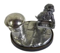 Silver smokers companion/table lighter in the form of a street urchin match seller & post box,