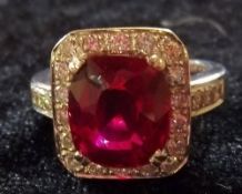 American 14ct gold ring set with stunning man made ruby surrounded by approx 1ct of diamonds -