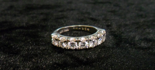 Diamond half hoop eternity ring, set with seven cut diamonds, marked 18ct, approx 1.4ct - size