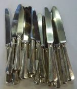 10 silver handled table knives & 6 silver handled dessert knives