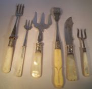 Bread fork, butter knife, 4 pickle forks (1 silver)