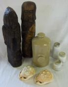 2 wooden figures, 2 pint old hot water bottle, a pair of large shells, etc