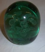 Green glass paperweight