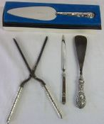 Silver handled curling tongs, letter knife, pie server & shoe horn