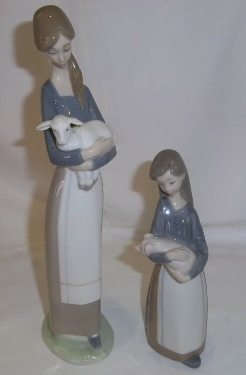 2 Lladro figurines: lady with lamb & girl with piglet
