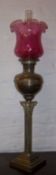 Brass parrafin lamp on a corinthium column