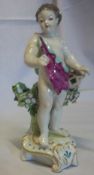 19th c. putto figurine with a basket of flowers