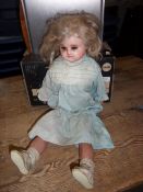 Doll with plaster head, cloth body & jointed limbs