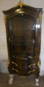 Leopard print vitrine with gilt embellishments