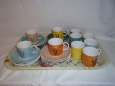 10 Susie Cooper coffee cans & saucers with plant motif