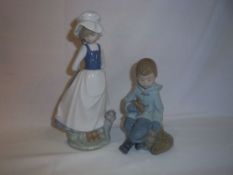 2 Nao figurines of a young girl & boy