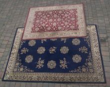 Large Oriental style rug on blue ground (size approx. 290cm x 200cm) with Oriental style rug on