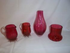 2 cranberry glass jugs, cranberry glass vase & cranberry glass vase on clear glass feet
