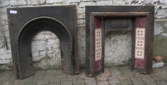 Cast iron fire surround with tiled decoration and one other cast iron insert