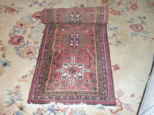 Oriental style wool runner on red ground size appropx. 250cm x 68cm
