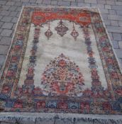 Middle Eastern style rug on red ground size approx. 185cm x 132cm