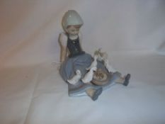 Lladro seated girl figurine feeding ducks from a bowl