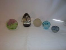 Caithness 'Cascade' paperweight, Caithness 'Calypso' paperweight & 3 others