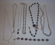 Silver bracelet set with amethyst stones, silver pendant set with CZ stones on silver chain etc.