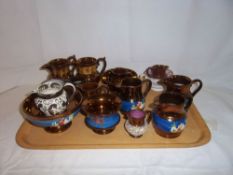 Sel. copper lustre jugs etc. with moulded enamel dec., silver lustre jug, pink lustre cup etc.