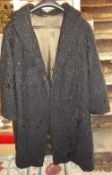 Black astrakhan coat