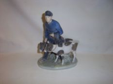 Royal Copenhagen figure group of a young stockman leading calves