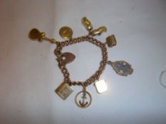 Tested as gold curb chain charm bracelet with sel. charms inc. 22ct gold wedding band