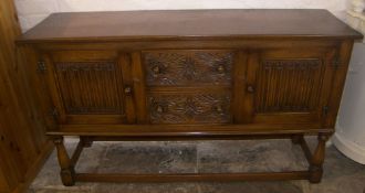 Carved oak sideboard with linen fold detail