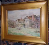 Gilt framed watercolour depicting cottages signed T N Tyndale size approx. 26cm x 20.5cm