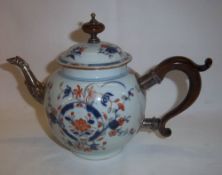 Chinese porcelain teapot with later added white metal spout & wooden handle