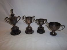 4 silver golfing trophies