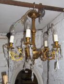 Gilt chandelier with cut glass droplets