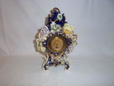 Decorative clock with applied flowers possibly Coalport