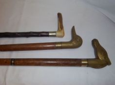 2 brass handled walking sticks & horn handled walking stick