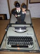 Cased Byron typewriter & Laurel & Hardy doorstop