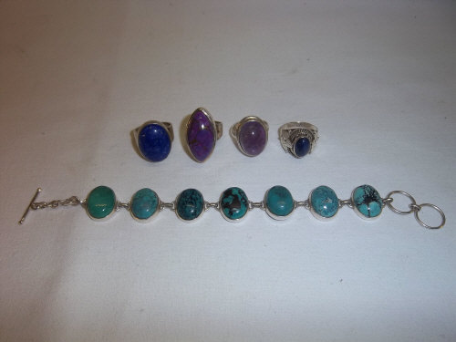 4 dress rings set with semi-precious stones marked 925 & bracelet