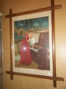 Framed Vict. print depicting young girl with child at a piano in Oxford frame