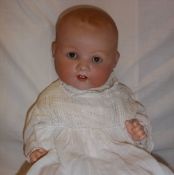 Armand Marseille bisque head doll marked 351/8K with fixed eyes, open mouth with teeth showing, on
