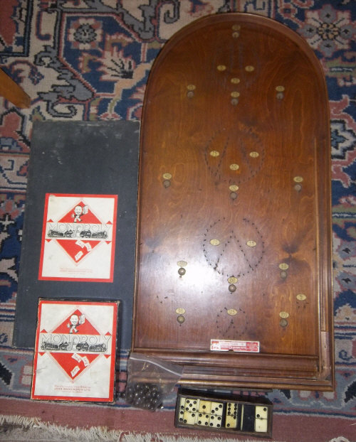 Bagatelle board, cased bone dominoes & Monopoly game