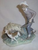 Lladro boy with wheel barrow figurine