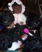 Sel. black vinyl dolls