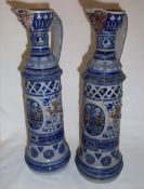 Pr of German steins with moulded dec. inc. armorial crests