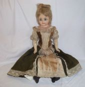Wax shoulder head doll with wood wool body & composition arms & legs ht approx. 62cm