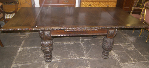 Lt. Vict. oak draw leaf table with heavily carved Jacobean style legs, total length extended approx.