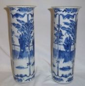 Pr of Chinese porcelain blue & white cylindrical vases decorated with standing female figure against